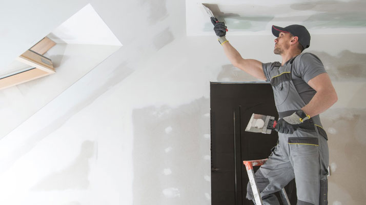 Drywall patch mismatch visible due to poor blending